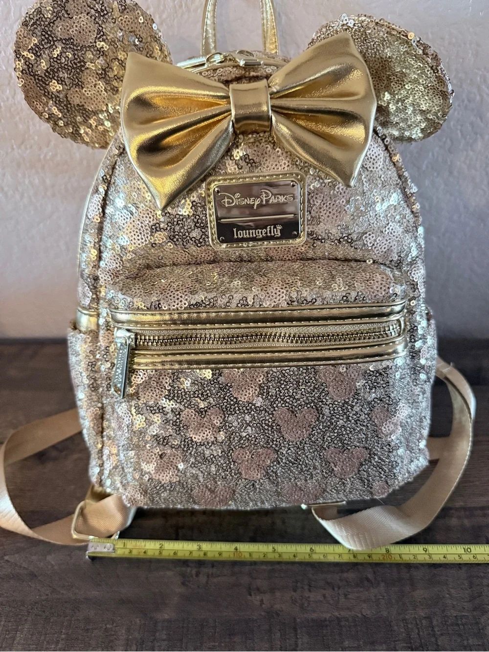 Loungefly Disney gold sequin backpack with hidden mickeys